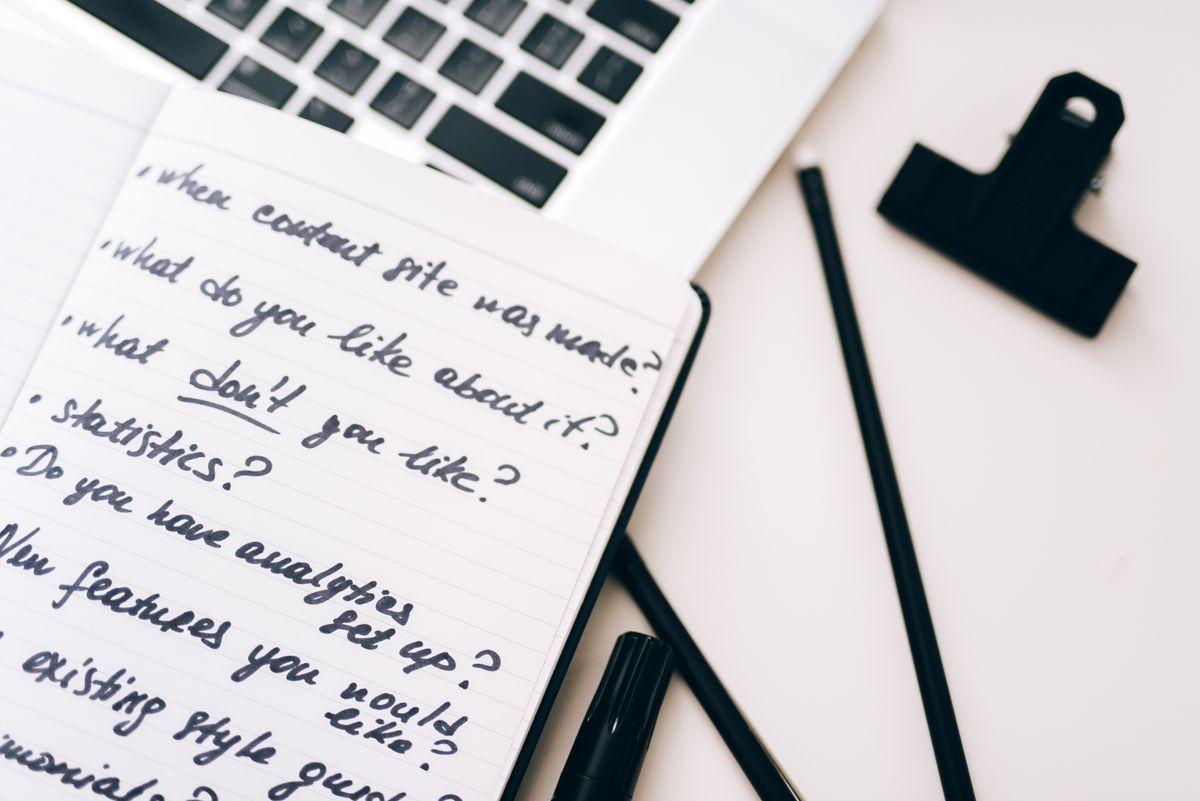 Planning a content calendar alongside a laptop